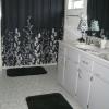 Master bath with shower and large vanity with double sinks